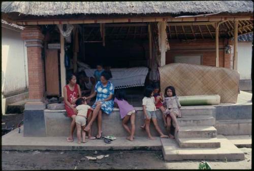 People outside an open house