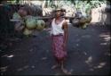 Man carrying coconuts