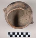 Monochrome rounded pottery bowl - incised decoration around rim; two vertically