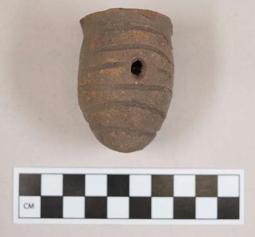 Pottery lug with incisions and perforations