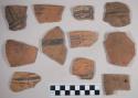 Ceramic earthenware sherds; some rim sherds; some with polychrome decoration; one with drilled hole