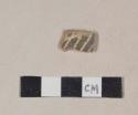 Coarse red bodied earthenware body sherd, with brown slip and white slipped stripes