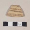 Buff bodied earthenware body sherd, with buff slip and white slipped stripes