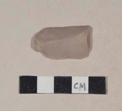 Chipped stone, flint blade, with polishing along one edge