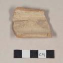 Red bodied earthenware body sherd, with buff slip