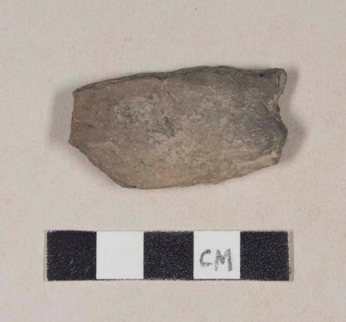 Burned, coarse red bodied earthenware body sherd, unslipped