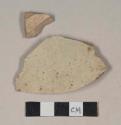 Red bodied earthenware body sherds, with buff slip, reduced core, wheel thrown; crossmend with base sherd from 39-18-60/21742
