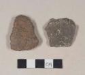 Burned, coarse red bodied earthenware body sherds, unslipped, possibly polished