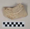 Red bodied earthenware base sherd, with buff slip, reduced core, wheel thrown; crossmends with body sherds from 39-18-60/21742