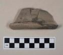 Red bodied earthenware rim sherd, with black slip, wheel thrown, partially burned interior