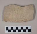 Coarse buff bodied earthenware body sherd, unslipped