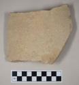 Coarse buff bodied earthenware body sherd, unslipped