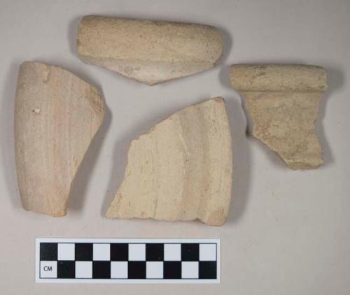 Coarse buff bodied earthenware rim sherds, unslipped