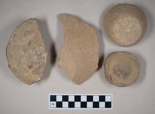 Coarse buff bodied earthenware base sherds, unslipped