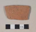 Coarse red bodied earthenware body sherd, unslipped