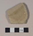 Buff bodied earthenware base sherd, unslipped, wheel thrown