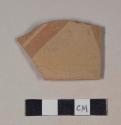Red bodied earthenware rim sherd, unslipped, with red slipped stripes