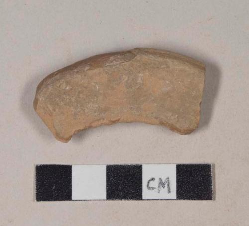 Red bodied earthenware rim sherd, with possible buff slip stripe