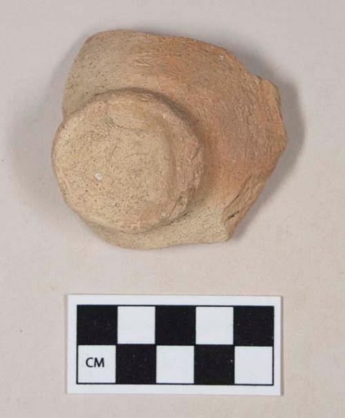 Coarse red bodied earthenware base sherd, with buff slip