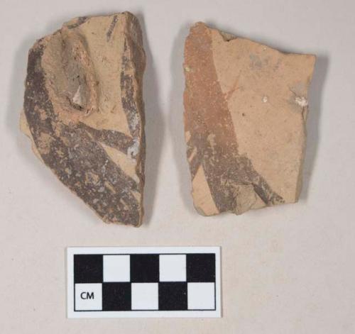 Coarse red bodied earthenware body sherds, with handle attachments, with black slipped stripes, reduced cores