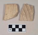 Molded, coarse buff bodied earthenware body sherds, unslipped