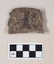 Coarse brown bodied earthenware rim sherd, with incised pattern