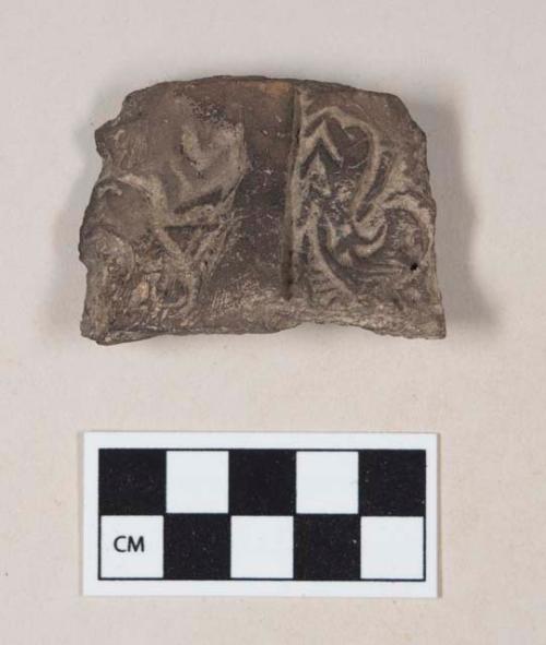 Coarse brown bodied earthenware rim sherd, with incised pattern