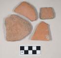 Coarse red bodied earthenware body sherds, unslipped, reduced cores