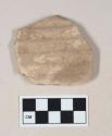 Coarse buff bodied earthenware body sherd, unslipped, molded