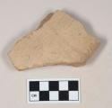 Coarse red bodied earthenware body sherd, with buff slip, molded; crossmends with 39-18-60/21855