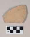Red bodied earthenware body sherd, with buff slip, wheel thrown