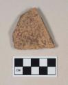 Coarse red bodied earthenware body sherd, unslipped, reduced core