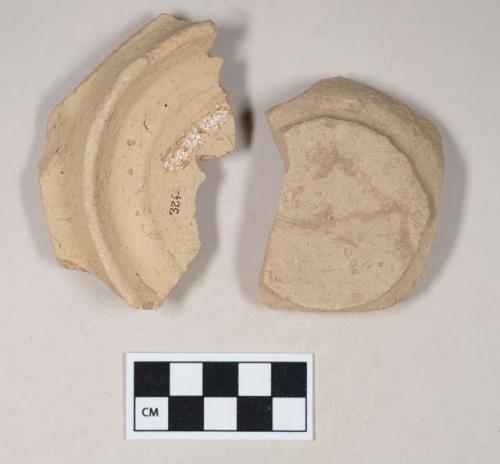 Coarse buff bodied earthenware base sherds, unslipped