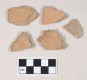 Coarse red bodied earthenware body sherds, unslipped, reduced core; two sherds crossmend