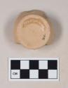 Coarse red bodied earthenware base sherd, unslipped, burned interior