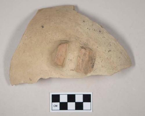 Red bodied earthenware body sherd, with buff slip, with handle attachments