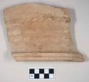 Coarse red bodied earthenware rim sherd, unslipped, with incised lines and molding