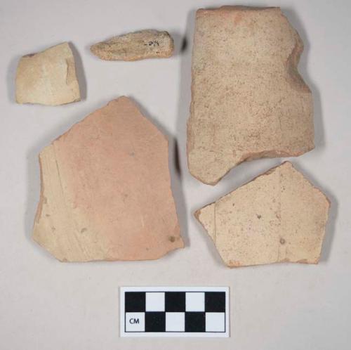 Coarse red bodied earthenware body sherds, with buff slip