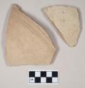 Coarse red bodied earthenware body sherds, with buff slip and incised lines