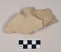 Coarse buff bodied earthenware body sherd, with buff slip and incised decoration