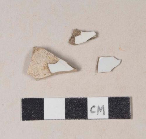 Undecorated whiteware body sherds; two sherds crossmend