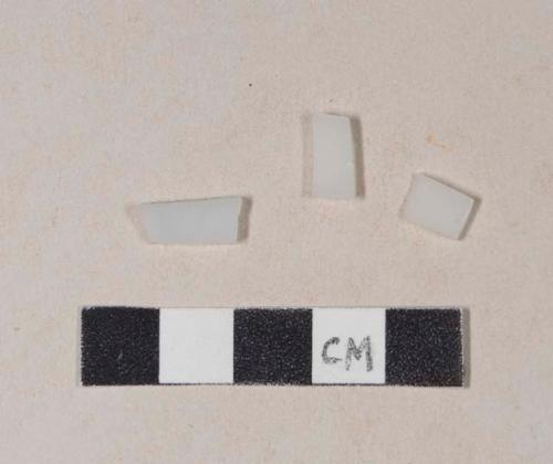 Curved milk glass fragments