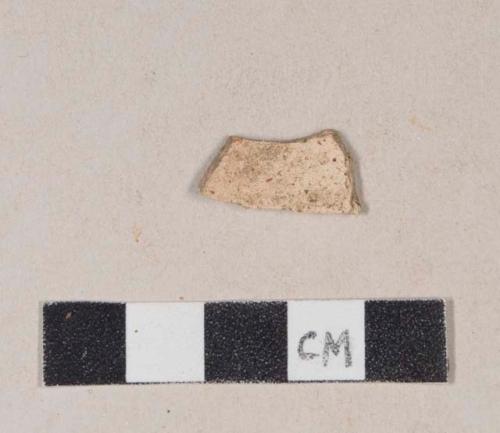 Unglazed, buff bodied coarse earthenware body sherd