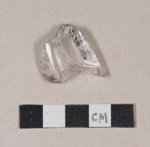 Molded colorless bottle glass fragment, possible base fragment