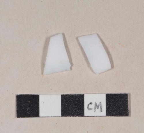 Milk white bottle glass fragments