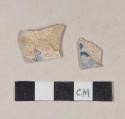 Burned blue transfer printed refined earthenware body sherds