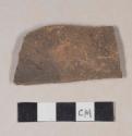 Unglazed, undecorated coarse earthenware body sherd with mica inclusions