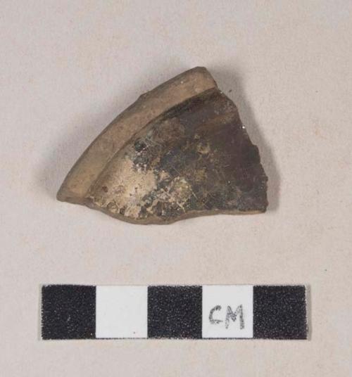 Undecorated lead glazed redware base sherd