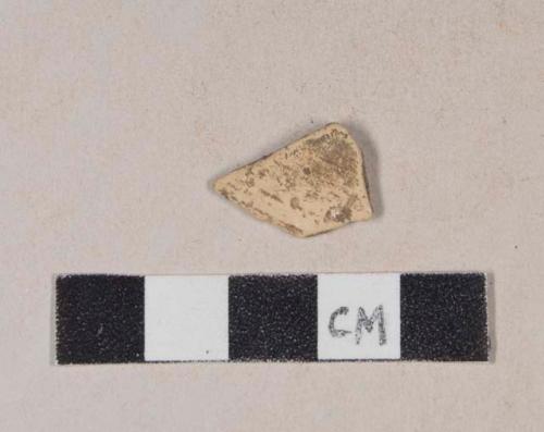 Tin glaze earthenware body sherd, missing all glaze