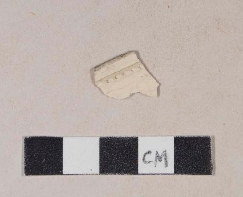 Molded creamware rim sherd